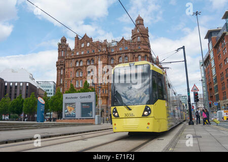 Metrolink tram with Midland hotel in the background in central Manchester. Stock Photo