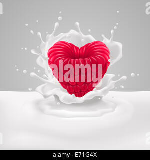 Appetizing raspberry heart with in milk splashes Stock Photo