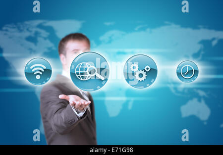 Business man hold blue application icons in hand Stock Photo