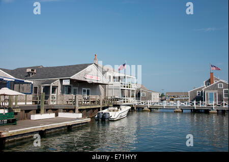 USA, Massachusetts, Nantucket, Straight Wharf. Typical Historic wooden stilted fishing cottages along Straight Wharf. Stock Photo