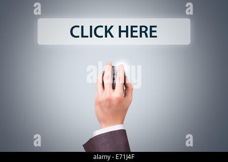 Technology concept, businessman hand holding mouse with click here text button. Stock Photo
