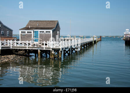 USA, Massachusetts, Nantucket, Straight Wharf. Typical Historic wooden stilted fishing cottages along Straight Wharf. Stock Photo