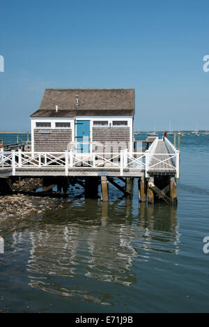 USA, Massachusetts, Nantucket, Straight Wharf. Typical Historic wooden stilted fishing cottages along Straight Wharf. Stock Photo