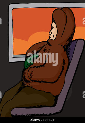 European man in coat sitting on train Stock Photo