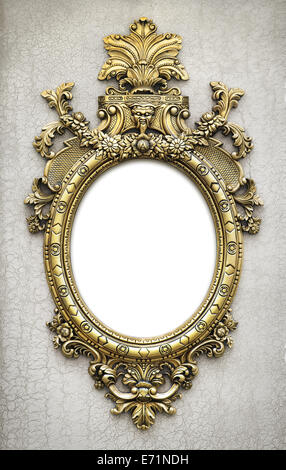 beautiful and complex golden baroque frame hanged on a textured wall Stock Photo