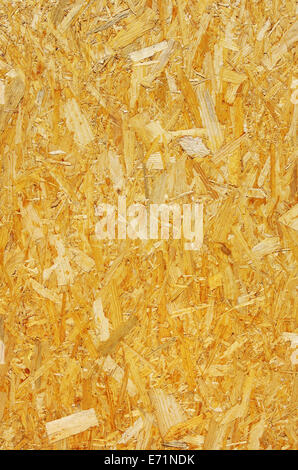 Yellow background surface of compressed yellow wood splinters and sawdust Stock Photo