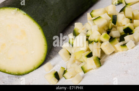 Fresh marrow or courgette cut into batons and diced into small cubes for use in salads and as a vegetable in cooking Stock Photo