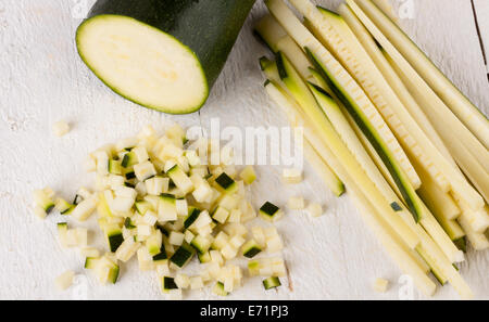 Fresh marrow or courgette cut into batons and diced into small cubes for use in salads and as a vegetable in cooking Stock Photo