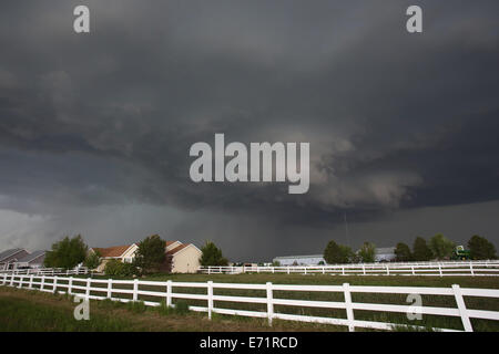 A supercell storm over homes in eastern Colorado. Stock Photo