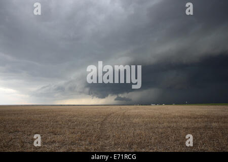A storm rolling over a field in eastern Colorado. Stock Photo
