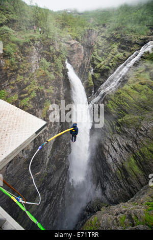 bungee jumping into a waterfall from the Gorsa Bridge in northern Norway Stock Photo