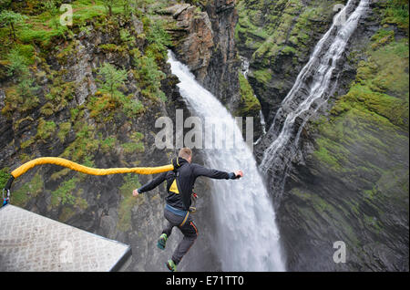 bungee jumping into a waterfall from the Gorsa Bridge in northern Norway Stock Photo