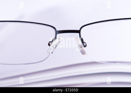 Focused on eyeglasses on opened book Stock Photo