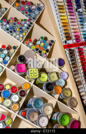 Button and cotton display in haberdashers. Norfolk, UK. Stock Photo