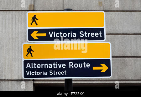 London, England, UK. Road signs for pedestrians. Alternative routes to Victoria Street (outside Victoria station) pointing in op Stock Photo