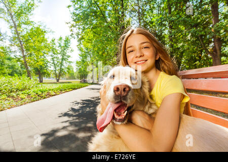 Close portrait of the teenage girl with happy dog Stock Photo