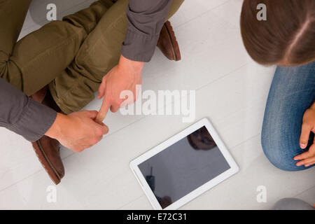 Friends looking digital tablet Stock Photo