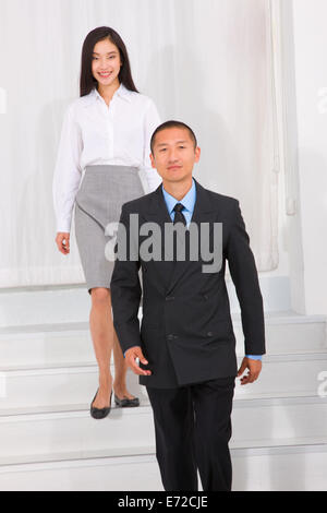 Businesspeople walking stairs Stock Photo