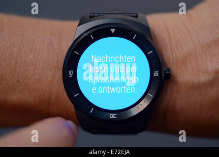 Berlin, Germany. 04th Sep, 2014. An LG G watch R is presented at the exhibition booth of LG during the second media preview day of the Consumer electronics and Home appliances fair IFA (for 'Internationale Funk Ausstellung'), in Berlin, Germany, 04 September 2014. IFA will take place from 05 to 10 September 2014. PHOTO: RAINER JENSEN/dpa/Alamy Live News Stock Photo