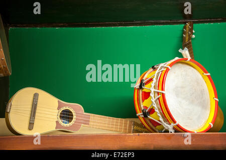 guitar and drum on a green background Stock Photo