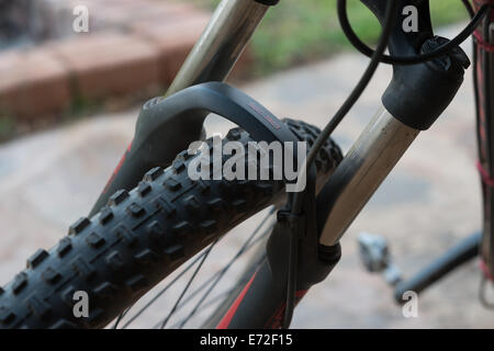 A large front wheel on a top end Specialized mountain bike. Stock Photo