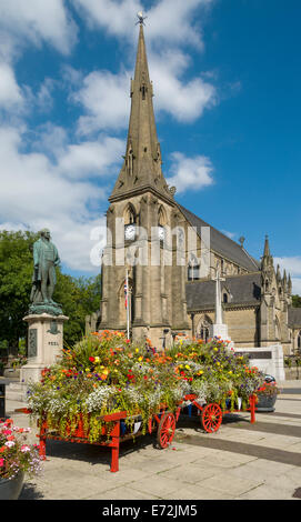 Church of St. Mary the Virgin, floral display and statue of Sir Robert Peel, Market Place, Bury, Greater Manchester, England, UK Stock Photo