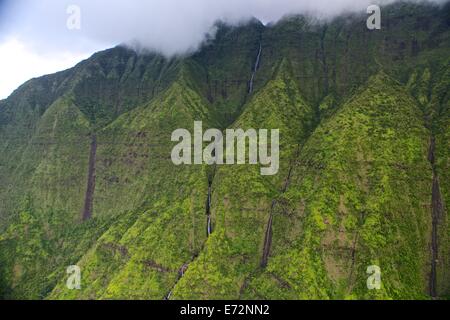 Aerial views of mountains and waterfalls from a helicopter in Kauai Stock Photo