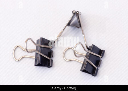 Closeup of several paper clips in different positions and arranged randomly. Stock Photo