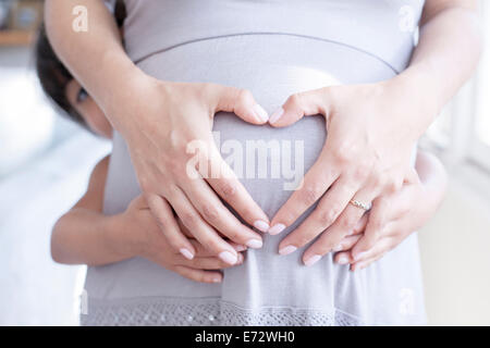 View of pregnant woman with daughter (6-7) Stock Photo