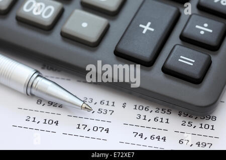 Financial statements. Calculator, ballpoint pen on financial statements. SDOF. Closeup. Stock Photo
