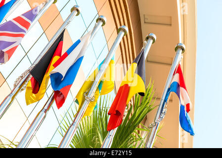 group of national flags on flagpoles Stock Photo