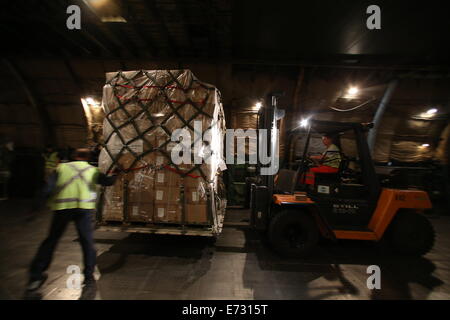 A plane, type Antonov 124, is loaded with military goods at the airport Leipzig/Halle, Germany, 04 September 2014. The German armed forces finished the preparations for the first delivery of military equipment to northern Iraq. Photo: Jan Woitas/dpa Stock Photo