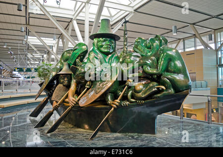 Beautiful 'The Spirit of Haida Gwaii:  The Jade Canoe' by indigenous sculptor Bill Reid, at Vancouver International Airport. First Nations art at YVR. Stock Photo