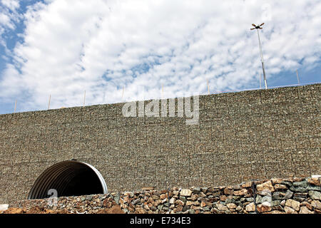 Gabions and tube with blue sky Stock Photo
