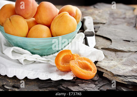 Nectarines in a pretty blue glass bowl. Extreme shallow depth of field. Stock Photo