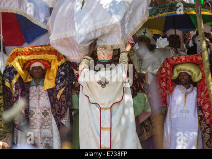 Priests Carrying Some Covered Tabots On Their Heads During Timkat Epiphany Festival, Lalibela, Ethiopia Stock Photo