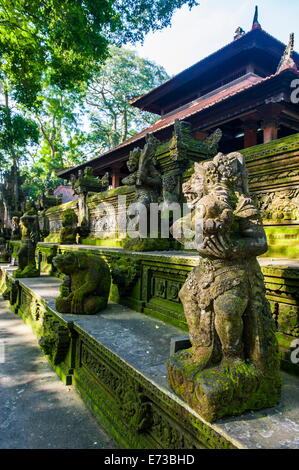 Overgrown statues in a temple in the Monkey Forest, Ubud, Bali, Indonesia, Southeast Asia, Asia Stock Photo