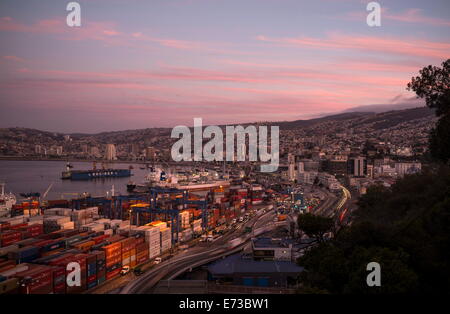 View of city and ports at dusk from Paseo 21 de Mayo, Cerro Playa Ancha, Valparaiso, Central Coast, Chile, South America Stock Photo