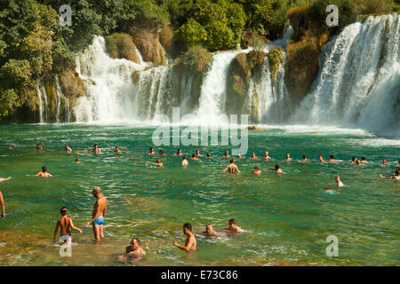 KRKA,CROATIA - AUGUST 2014. Tourists enjoy a bath at Krka waterfalls in Krka National park, great attraction near Sibenik. Stock Photo