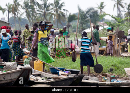 Africa, Benin, Ganvie. Locals gathered at fish market on shore of Lake Nokoue. Stock Photo