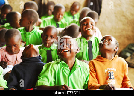 Kenya, Kakamega, African schoolchildren studying with a smile in classroom (MR). Stock Photo