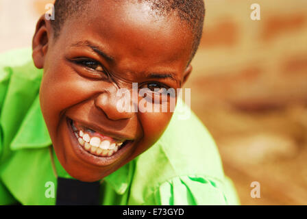 Kenya, Kakamega, portrait of smiling schoolboy in uniform with a tie (MR). Stock Photo