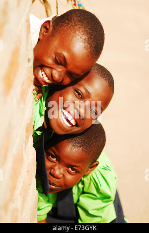 Kenya, Kakamega, portrait of 3 schoolboys smiling (MR). Stock Photo