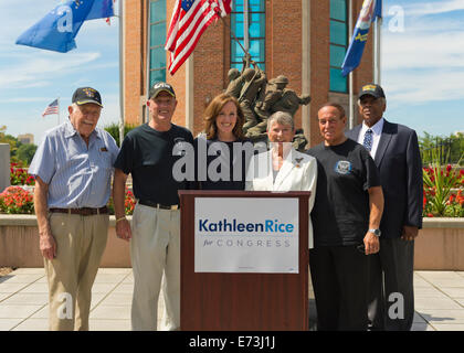 East Meadow, New York, USA. 3rd September, 2014.  At center, KATHLEEN RICE (in black), Democratic congressional candidate (NY-04), and outgoing Representative CAROLYN MCCARTHY (in white) are at Veterans Memorial at Eisenhower Park, after they toured Northport VA Medical Center. Rice released a whitepaper on veterans policy and announced the formation of her campaign's new Veterans Advisory Committee, and 4 of its members participated at the press conference: PAUL ZYDOR, (in blue shirt) of Merrick, U.S. Navy, Korean War Veteran; PAT YNGSTROM, (in black T-shirt and cap) of Merrick, U.S. © Ann E Stock Photo