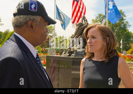 East Meadow, New York, USA. 3rd September, 2014.  KATHLEEN RICE, Democratic congressional candidate (NY-04), is speaking with one of the members of her campaign's new Veterans Advisory Committee, JEREMIAH E. BRYANT, of Rockville Centre, U.S. Army, Vietnam War Veteran. Rice announced formation of the committee and released a whitepaper on veterans policy, at Veterans Memorial at Eisenhower Park. Rice is in her third term as Nassau County District Attorney, Long Island. Credit:  Ann E Parry/Alamy Live News Stock Photo