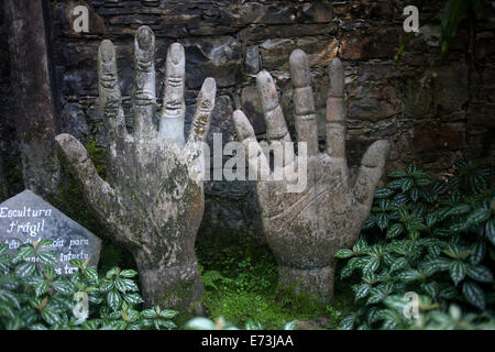 A sculpture of two hands decorate Las Pozas of Edward James in Xilitla, San Luis Potosi, Mexico, July 21, 2014. Stock Photo