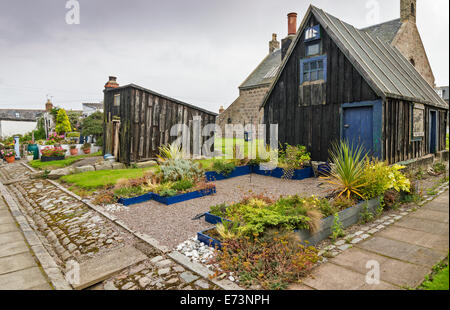 FOOTDEE OR FISHING VILLAGE IN ABERDEEN HARBOUR THE OLD TARRY SHEDS MADE FROM DRIFTWOOD Stock Photo