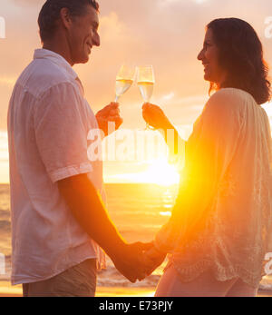 Happy Romantic Couple Enjoying Glass of Champagne at Sunset on the ...