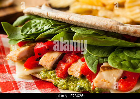 Healthy Grilled Chicken Pesto Flatbread Sandwich with Peppers and Spinach Stock Photo