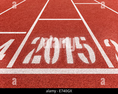 New year 2015 diggits on sport track with arrow. Good start, growing business concept. Stock Photo